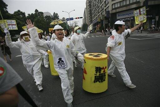 Demonstrators march in a protest against Taiwan`s use of nuclear power plants in Taipei, Taiwan.