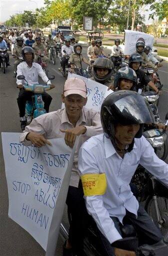 Supporters of Cambodian opposition Sam Rainsy Party on motorbikes march marking May Day celebration in Phnom Penh, Cambodia.