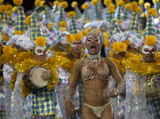 A Vila Maria samba school dancer performs in their parade during carnival celebrations in Sao Paulo, Brazil.