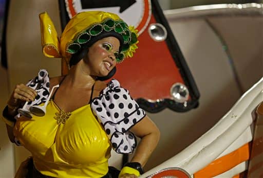 A dancer performs on a Sao Clemente samba school float during a carnival parade at the Sambadrome in Rio de Janeiro, Brazil.