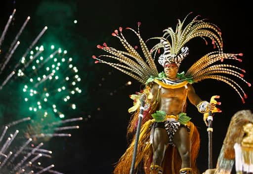 A dancer from the Imperatriz Leopoldinense samba school parades during Carnival celebrations at the Sambadrome in Rio de Janeiro, Brazil.