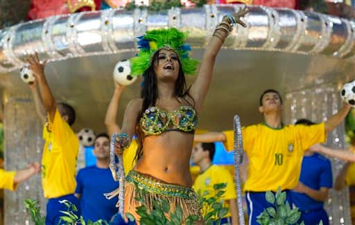 Lingerie model Larissa Riquelme of Paraguay waves from the top of a Vila Maria samba school float during carnival celebrations in Sao Paulo, Brazil.