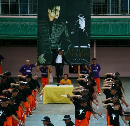 Inmates perform a Michael Jackson song to pay tribute to the King of Pop on his first death anniversary Saturday June 26, 2010 at the Cebu jail in Cebu city, central Philippines.