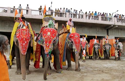 Decorated elephants stand during the Jal Yatra procession ahead of the 133rd annual Rath Yatra, or Chariot procession, which will be held on July 13, in Ahmadabad, India, Saturday, June 26, 2010. During Jal Yatra holy water from the Sabarmati River is carried and used for washing the idols of Hindu God Jagannath, his brother Balabhadra and sister Subhadra, which are then carried in a procession in specially made chariots during the Rath Yatra.