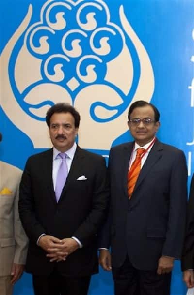 Pakistani Interior Minister Rehman Malik, left, and Indian Home Minister Palaniappan Chidambaram pose for a group photo during the South Asian Association for Regional Cooperation (SAARC) home ministers` conference in Islamabad, Pakistan, Saturday, June 26, 2010. Interior ministers from eight regional states opened a day-long meeting in Pakistani capital Islamabad with anti-terror cooperation top issue on agenda, officials said.