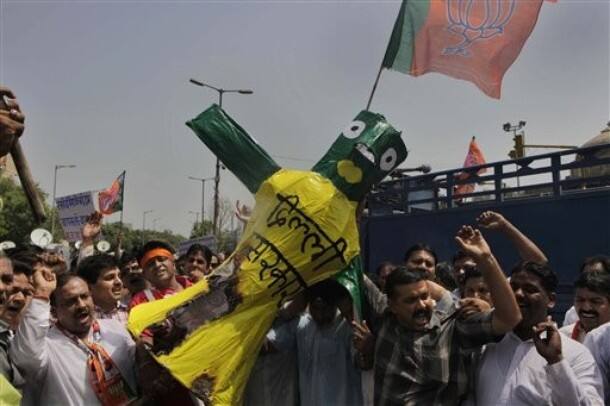 India`s main opposition Bharatiya Janata Party (BJP) activists burn an effigy representing the Delhi government during a protest against the hike in fuel price in New Delhi, India, Saturday, June 26, 2010. India`s government decided to hike fuel prices Friday, a politically contentious move analysts say could save the state $5.2 billion but exacerbate high inflation by as much as a percentage point.