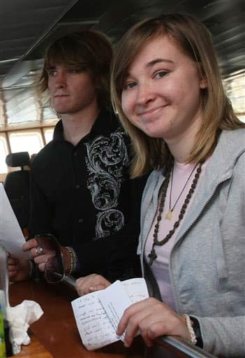 Abby Sunderland, 16, right, and her brother Zac Sunderland, from California pose on the French fisheries patrol boat