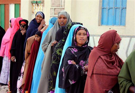 Somalis queue in Hargeisa, Somaliland, to cast their vote for presidential elections, Saturday, June 26, 2010. Electoral posters lined the streets of Somaliland as the self-declared republic prepared to hold its second presidential election on Saturday, an exercise in governance not seen for decades in the country`s anarchic south.