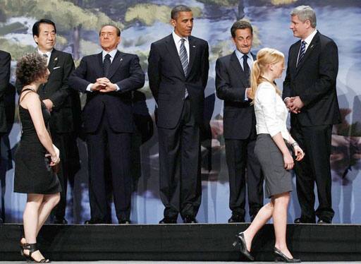 G8 leaders including (L-R) Japan`s Prime Minister Naoto Kan, Italy`s Prime Minister Silvio Berlusconi, United States President Barack Obama, France`s President Nicolas Sarkozy and Canada`s Prime Minister Stephen Harper stand on stage as