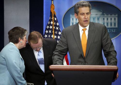 Director of Homeland Security Janet Napolitano, left, talks to White Press Secretary Richard Gibbs, center, as Dr. Richard Besser, right, Acting Director Center for Disease Control and Prevention speaks during a news conference at the White House to discuss reported Swine Flu outbreaks, Sunday, April 26, 2009 in Washington.