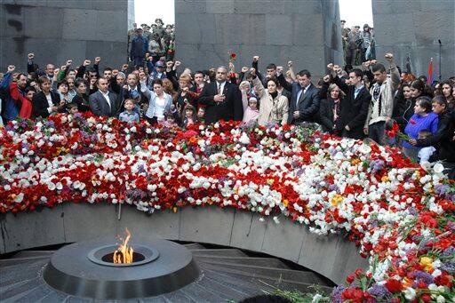 Armenians gather to mark the 94th anniversary of the mass killing of the Armenian people, at a monument in Yerevan,