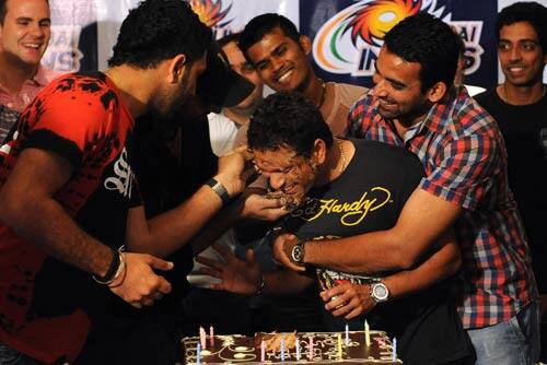 Sachin Tendulkar has cake smeared onto his face at a surprise birthday party at Durban.