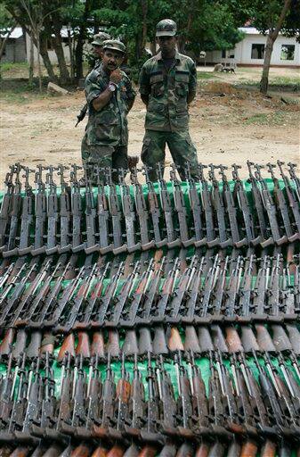 Sri Lankan soldiers prepare a display consisting of arms captured from Tamil Tiger rebels in Killinochchi, about 230 kilometers (143 miles) northeast of Colombo, Sri Lanka