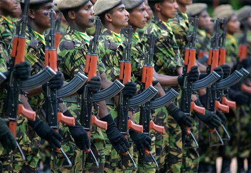 Sri Lankan police commandos march iduring a passing out ceremony of 177 officers at their training college in Kalutara, about 30 kilometers (19 miles) south of capital Colombo, Sri Lanka. An international rights group on Friday urged Sri Lanka`s military to stop firing artillery into a designated 