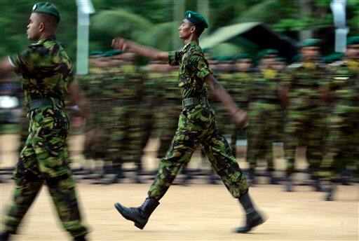 Sri Lankan police commandos march iduring a passing out ceremony of 177 officers at their training college in Kalutara, about 30 kilometers (19 miles) south of capital Colombo, Sri Lanka. An international rights group on Friday urged Sri Lanka`s military to stop firing artillery into a designated 