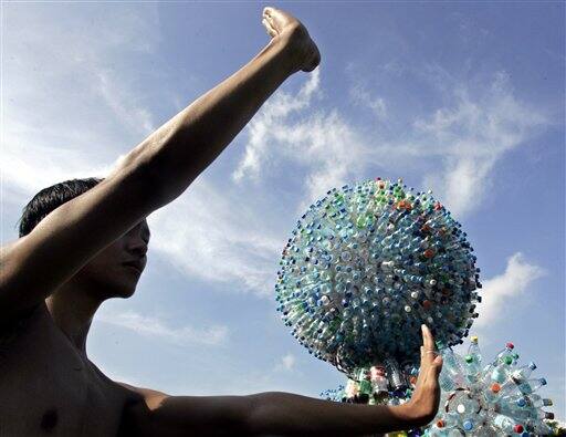 A dancer performs around an installation art titled `Thirst Scraps` which is made up of plastic bottles as the country joins the rest of the world to mark Earth Day. Artists Krizia Jenilee Lucero and Sara Ysabel Rodriguez, both high school students, explain 