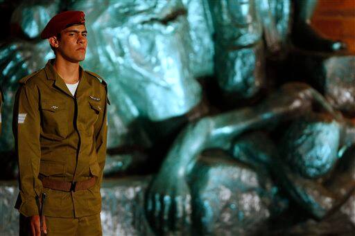 An Israeli soldier stands during the opening ceremony marking the Holocaust Remembrance Day at Yad Vashem Holocaust Memorial in Jerusalem.