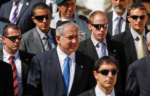 Israeli Prime Minister Benjamin Netanyahu, 2nd left, attends a ceremony marking the Holocaust Remembrance Day at Yad Vashem Holocaust Memorial in Jerusalem. Frenetic Israel came to a standstill for two mournful minutes on Tuesday as air-raid sirens pierced the air in remembrance of the 6 million Jews who perished in the Nazi Holocaust. Israeli leaders vowed that there would not be a second Holocaust.