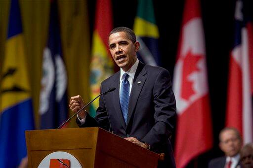 President Barack Obama gestures as he delivers a speech during the opening ceremony of the Summit of the Americas on Friday, April 17, 2009 in Port-of-Spain, Trinidad and Tobago.