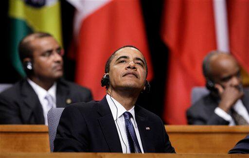 President Barack Obama attends the opening session of the 5th Summit of the Americas in Port of Spain, Trinidad and Tobago, Friday April 17, 2009.