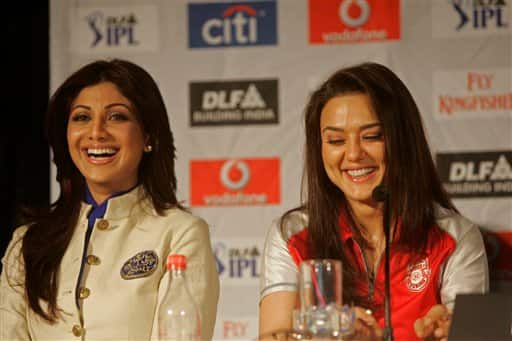 Bollywood actress Shilpa Shetty, left, and Preity Zinta, right, reacts at a press conference ahead of the Indian Premier League Twenty20 cricket matches to be held over the weekend in Cape Town, South Africa