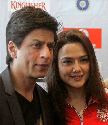 Bollywood movie stars Shah Rukh Khan, left, and Preity Zinta, right, stand for a photo after a press conference ahead of the Indian Premier League Twenty20 cricket matches to be held over the weekend in Cape Town