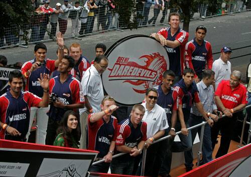 Delhi Daredevils cricket team members drive past during a parade through the streets of Cape Town, South Africa, ahead of the Indian Premier League Twenty20 cricket matches to be held over the weekend 