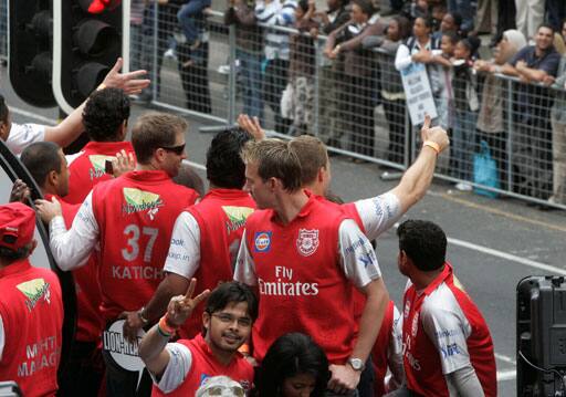 Kings Punjab cricket team members drive past during a parade through the streets of Cape Town, ahead of the Indian Premier League Twenty20 cricket matches to be held over the weekend in Cape Town