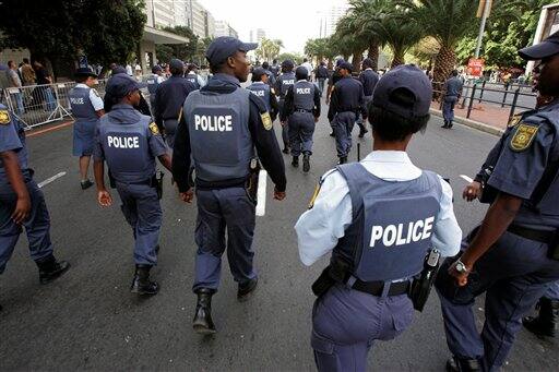 South African Police provide security at a parade for cricket fans ahead of the Indian Premier League Twenty20 cricket matches to be held over the weekend in Cape Town