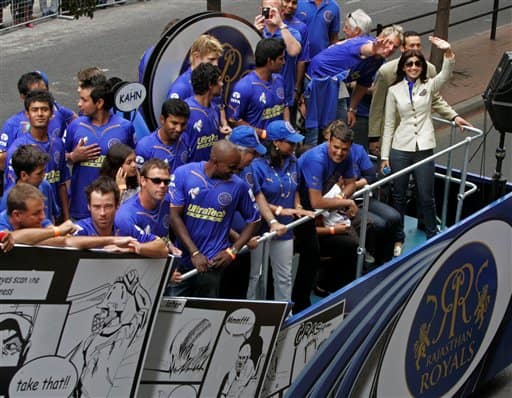 Bollywood actress Shilpa Shetty, far right, waves on top of the Rajasthan Royals bus during a parade through the streets of Cape Town, ahead of the Indian Premier League Twenty20 cricket matches to be held over the weekend in Cape Town, South Africa