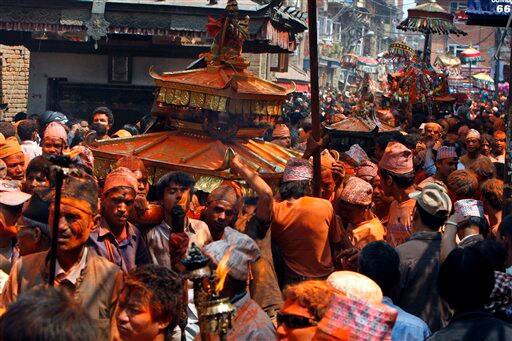 Locals of Thimi carry chariots containing images of Bhairava and Bhadrakali around the city as they celebrate the Bisket Jatra Hindu festival on the outskirts in Katmandu, Nepal, Wednesday, April 15, 2009. During this festival, also regarded as a New Year festival.