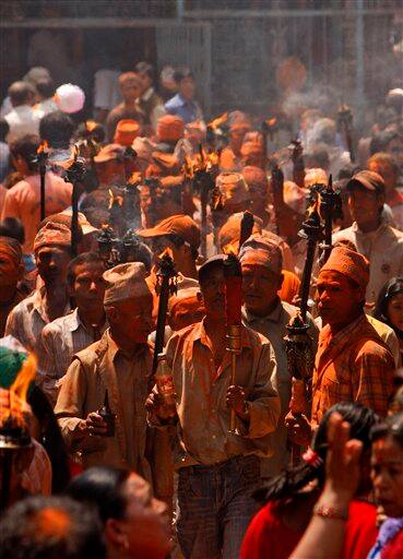 Locals of Thimi participate in a rally to celebrate the Bisket Jatra Hindu festival on the outskirts in Katmandu, Nepal, Wednesday, April 15, 2009. During this festival, also regarded as a New Year festival, images of the Hindu God Bhairav and his female counterpart Bhadrakali are enshrined in two large chariots and pulled to an open square after which rituals and festivities follow.