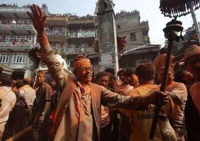 People sing and dance during the second day of celebrations for Navavarsha, or the Nepalese New Year, at Thimi, in Kathmandu April 15, 2009. Navavarsha, which falls on April 14 this year, is a national holiday and people celebrate by carrying chariots of various Gods and Goddesses.