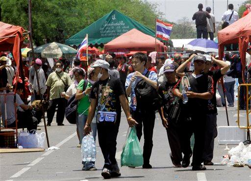 Anti-government protesters and supporters of ousted Prime Minister Thaksin Shinawatra leave the protest venue after their leaders surrendered ending the nearly two-week anti-government protest in Bangkok, Thailand. Leaders of demonstrations that plunged Thailand`s capital into chaos called off their protests Tuesday following rioting and clashes that left two dead and more than 120 injured across Bangkok.