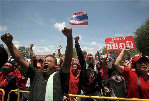 Thai anti-government protesters react after leaders called off their rally outside Government House in Bangkok, Thailand. Leaders of demonstrations that plunged the Thai capital into chaos said Tuesday that they were calling off their protests after combat troops ringed their last stronghold