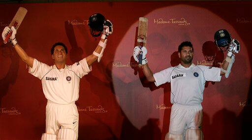 Indian cricket player Sachin Tendulkar, right, poses next to his wax figure in Mumbai, India, Monday, April 13, 2009.