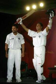 Indian cricketer Sachin Tendulkar (L) poses with his new wax statue made by Madame Tussauds London museum, during its unveiling in Mumbai April 13, 2009.