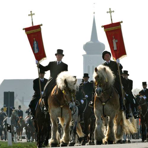 Easter riders ride through the village in Ralbitz, eastern Germany, Sunday, April 12, 2009. According to a more than hundred years old tradition, men of the Sorbs, dressed in black tailcoats riding on decorated horses, proclaiming singing and praying the message of Jesus resurrection. The Sorbs are a Slavic German minority located near the German-Polish border.