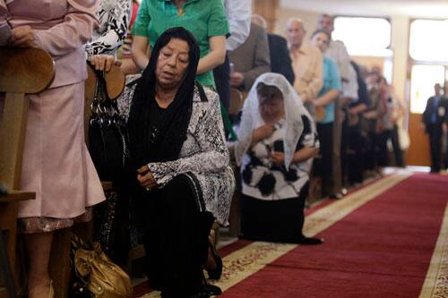 Iraqi Christians pray during Easter Mass in a church in Baghdad, Iraq, Sunday, April 12, 2009. 