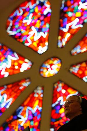 Bosnian Catholic nun says her prayes during morning Easter prayer at the church in Vares, 40 kms north of Sarajevo, on Sunday, April 12, 2009