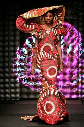 A model presents a creation by Senegal`s fashion designer Eva Gabarra during the presentation of Dutch company Vlisco`s Urban Beat Collection,in Paris. Gabarra sent out glamazon gowns with sweeping trains and standup collars, said she was aiming to seduce the youngest generation of Africa`s elite.