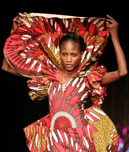 A model presents a creation by Senegal`s fashion designer Eva Gabarra during the presentation of Dutch company Vlisco`s Urban Beat Collection,in Paris. Gabarra sent out glamazon gowns with sweeping trains and standup collars, said she was aiming to seduce the youngest generation of Africa`s elite.