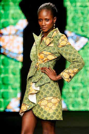 A model presents a creation by Cameroon-based fashion designer June during the presentation of Dutch company Vlisco`s Urban Beat Collection