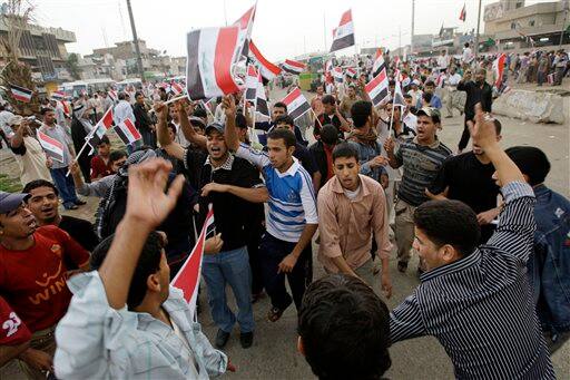 Supporters of anti-U.S. Shiite cleric Muqtada al-Sadr gather in central Baghdad, Iraq, for a rally marking the sixth anniversary of the fall of the Iraqi capital to American troops