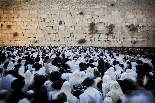 Ultra Orthodox Jewish men wrapped in prayer shawls participate in the special 