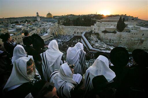 Ultra Orthodox Jewish men wrapped in prayer shawls participate in the special 