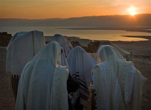 Ultra Orthodox Jewish men wrapped in prayer shawls participate in the special 