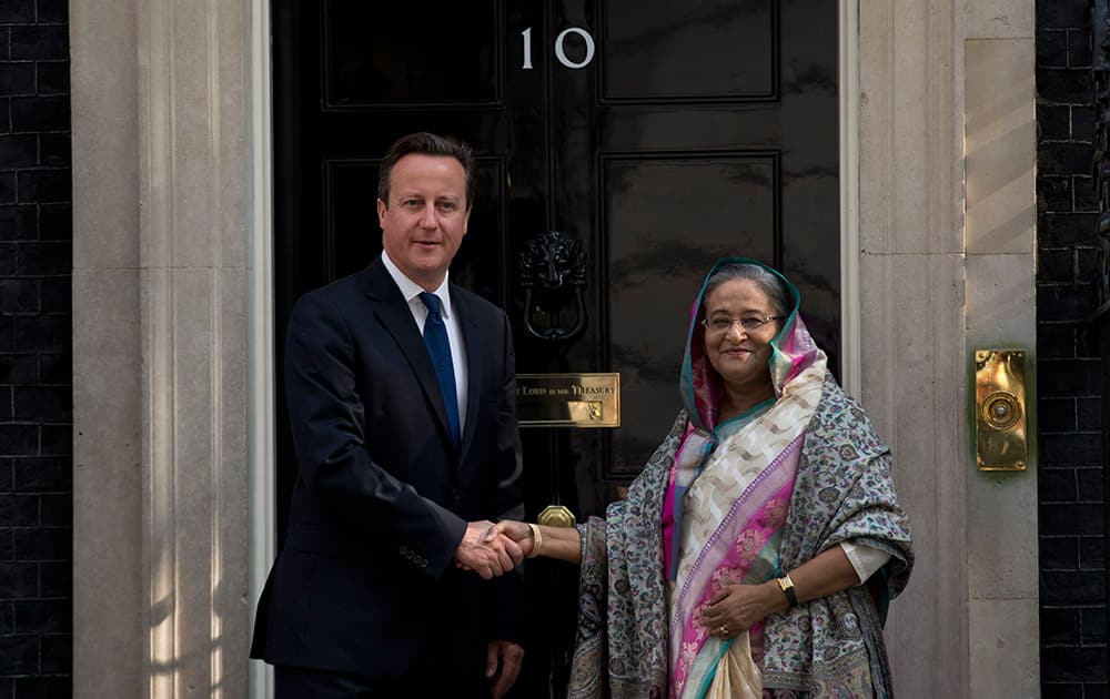 British Prime Minister David Cameron, left, and Bangladesh Prime Minister Sheikh Hasina pose for photographers outside 10 Downing Street, before the start of their meeting in London.