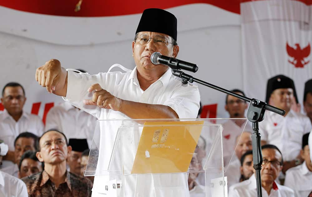 Indonesian presidential candidate Prabowo Subianto gestures during a press conference in Jakarta, Indonesia.