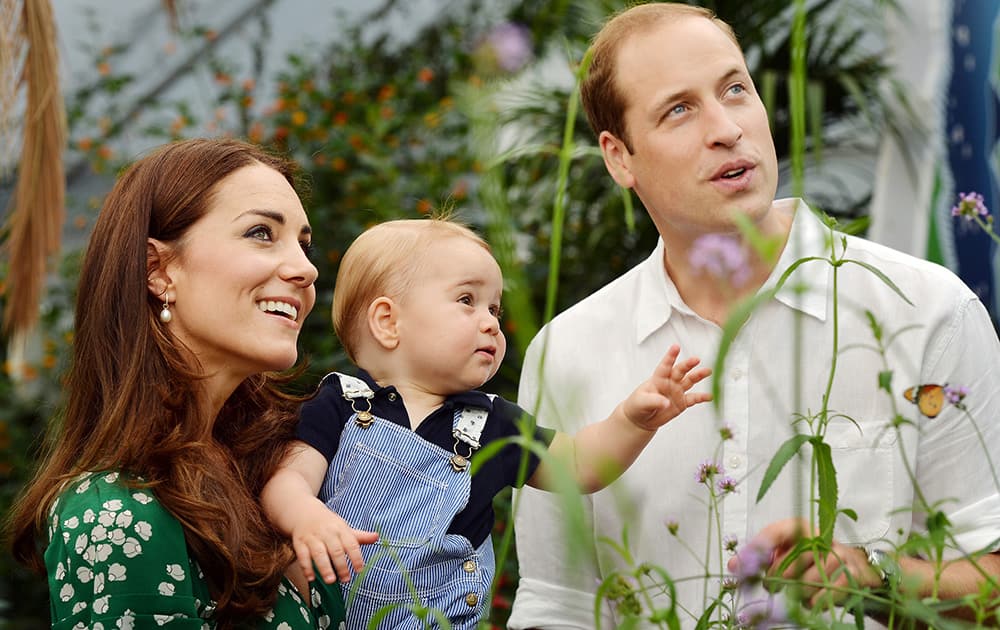 File Photo- Britain`s Prince William, Kate Duchess of Cambridge and Prince George. Today is baby Prince George`s first birthday.